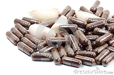 Garlic herbal capsules,oral medicine,alternative medicine isolated on white background. Stock Photo