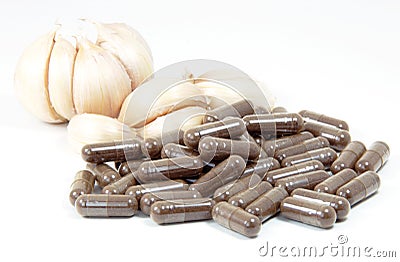 Garlic herbal capsules,oral medicine,alternative medicine isolated on white background. Stock Photo