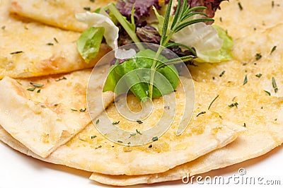 Garlic pita bread pizza with salad on top Stock Photo