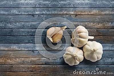 Garlic on wood surface. Stock Photo