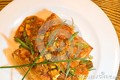 Garnished baked meat dish Stock Photo