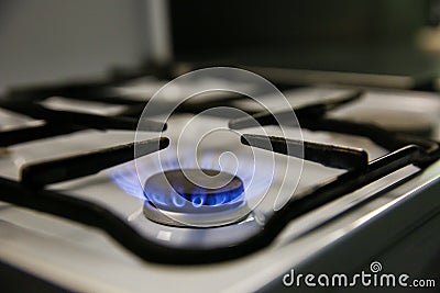 Gas burns on the kitchen stove. Stock Photo
