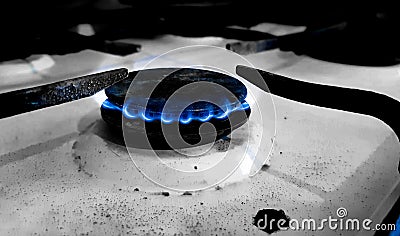 The gas flames of an old and dirty stove Stock Photo