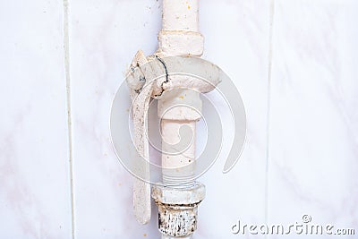 Gas isolating valve on a pipe in kitchen, danger risk hazard of household gas explosion and emergency situation Stock Photo