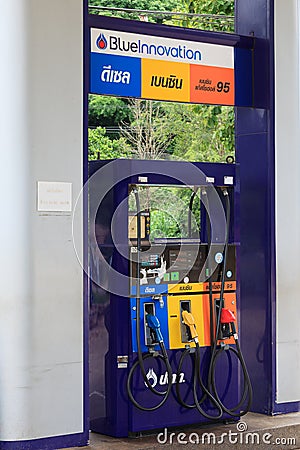 Gas pump nozzles in a service station. Editorial Stock Photo