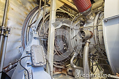 Gas turbine engine of feed gas compressor inside enclosure. Stock Photo