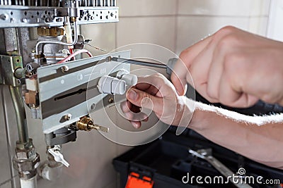 Gas water heater reparation Stock Photo