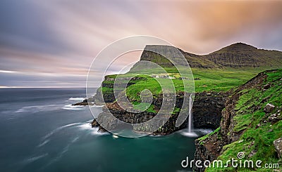 Gasadalur village and its waterfall, Faroe Islands, Denmark Stock Photo