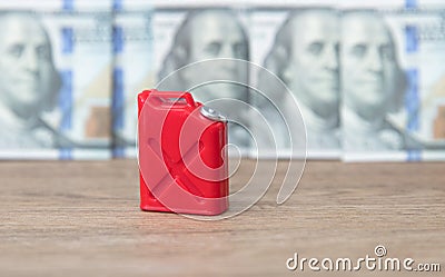 Gasoline barrel in front of dollar banknotes background Stock Photo