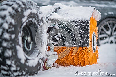 Gasoline Brush Broom Snow Removal Machine in Action Stock Photo