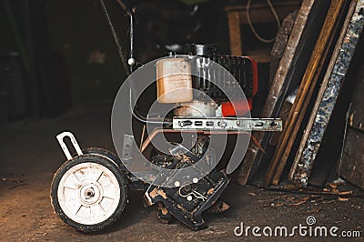 Gasoline motor-hoe for digging the earth in the garden Stock Photo