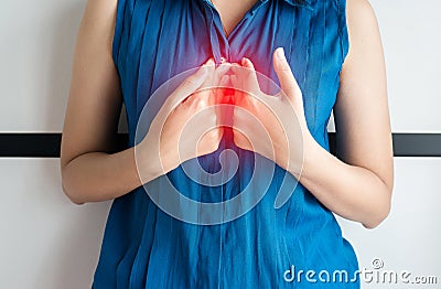 Asian woman having or symptomatic reflux acids Stock Photo