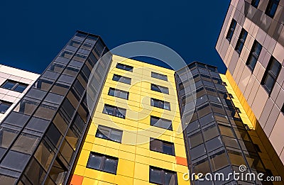 Gatchina, Russia - April 7, 2018: A modern new building against the blue sky. The building has a bright yellow and white Editorial Stock Photo