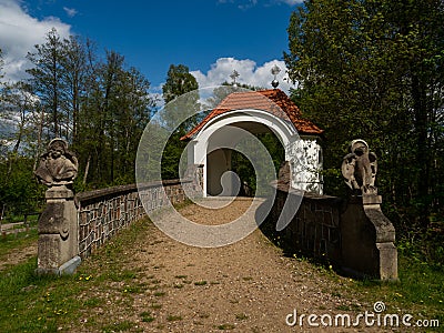 Gate being part of the Way of the Cross, surrounded by the park. Stock Photo