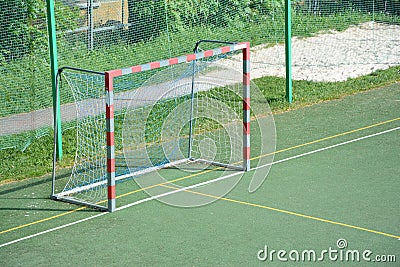 Gate on empty small football field Stock Photo