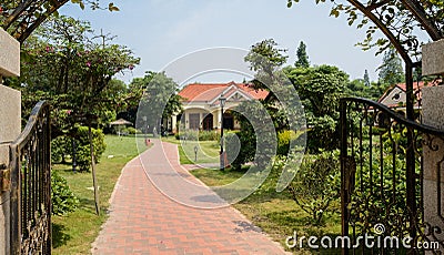 At gate of enclosed fresh buildings in plants of sunny summer mo Stock Photo