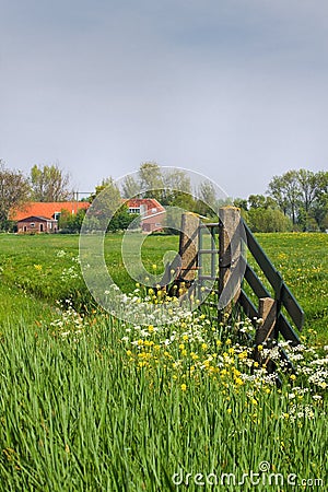 Gate and farm in Dutch country landcape Stock Photo