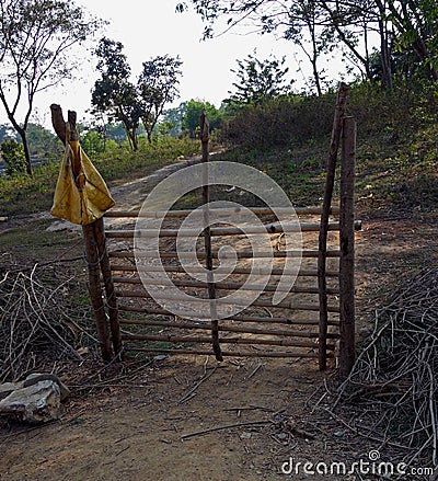 A gate made with bamboo at an Indian field. Stock Photo