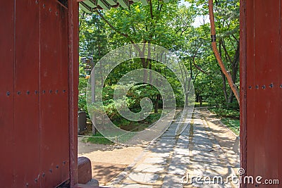 A gate opening to a sacred path, Jongmyo shrine, Seoul Stock Photo
