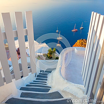 Gate to heaven. Santorini, Greece. White architecture, open doors and steps to the blue sea of Santorini Stock Photo