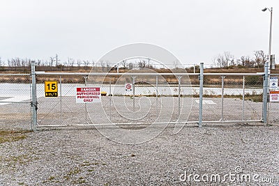 Gate to a Restricted Area on a Cloudy Day Stock Photo