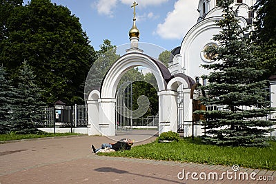Gates of the Temple of the Birth of Christ and sleeping man. Sunny summer view. Editorial Stock Photo