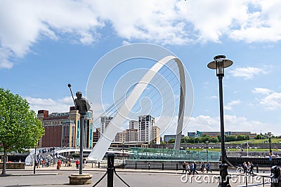 Gateshead Millennium Bridge is a pedestrian and cyclist tilt bridge spanning the River Tyne Editorial Stock Photo