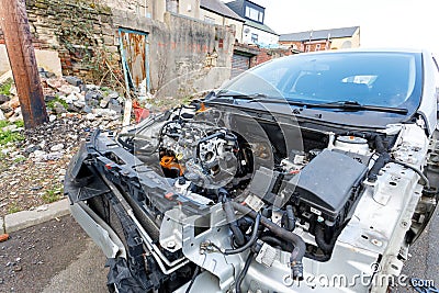 A broken down car with bonnet removed awaiting repair Editorial Stock Photo