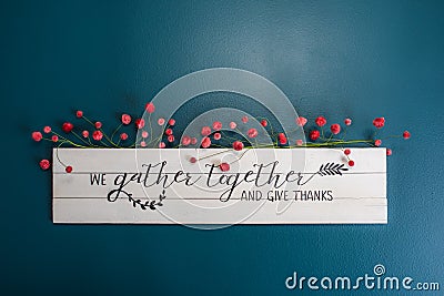 We gather together and give thanks sign on the wall Stock Photo