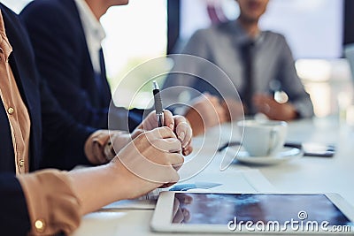 Gathered to make business great. a group of businesspeople having a meeting in the boardroom of a modern office. Stock Photo