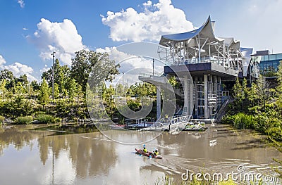 The Gathering Place - Award winning public park in Oklahoma - Modern Boat House with boats rowing in pond and Editorial Stock Photo