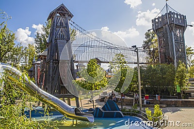 The Gathering Place - Award winning public theme park in Oklahoma - Parents sitting in shade of climbing Editorial Stock Photo