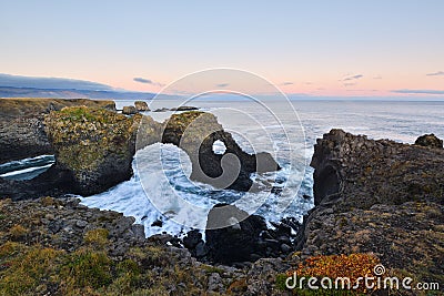 Gatklettur at autumn sunset, an Arch Rock in west Iceland Stock Photo