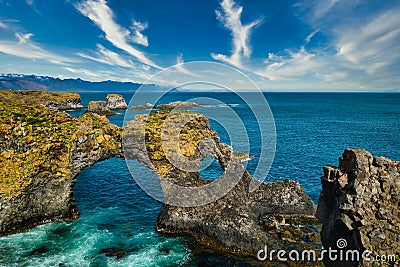 Gatklettur rock formations on Snaefellsnes peninsula and atlantic ocean on sunny day Stock Photo
