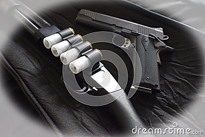 12 Gauge Shotgun With 1911 45 Auto Handgun Close Up With White Vignette Effect Stock Photo