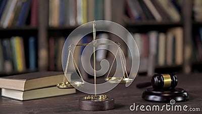 Gavel and Balance Scale on Judge Wooden Table Stock Photo