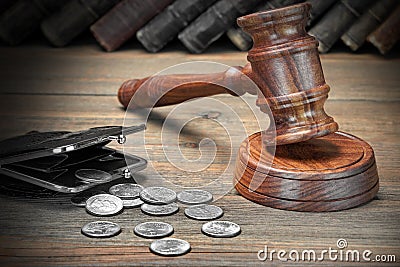 Gavel, Empty Purse, Coins, And Old Book On Wooden Table Stock Photo