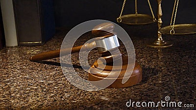 Gavel, scales of justice and law books on marble Stock Photo