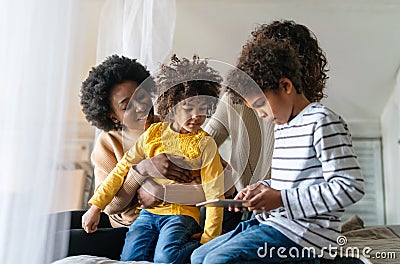 Gay couple children love happiness concept. Happy multiethnic family spending time together at home Stock Photo