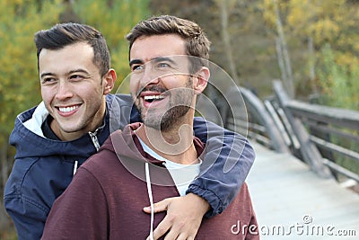 Gay couple enjoying the park in autumn Stock Photo