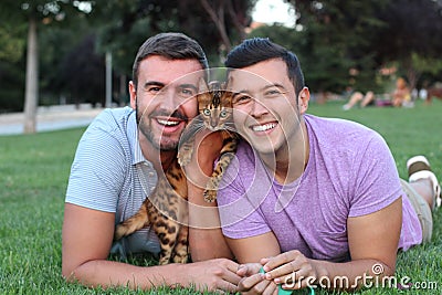 Gay couple in the park with their pet Stock Photo