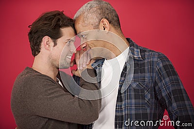 Gay couple on red background Stock Photo