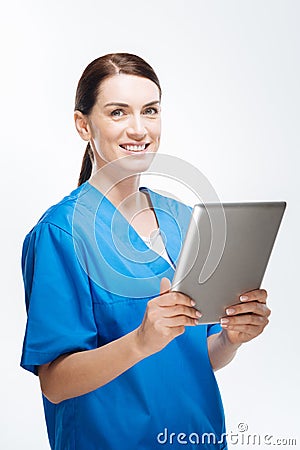 Gay female doctor typing data Stock Photo