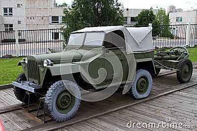 GAZ-67 passenger car with towed mine-thrower on grounds of weapo Editorial Stock Photo