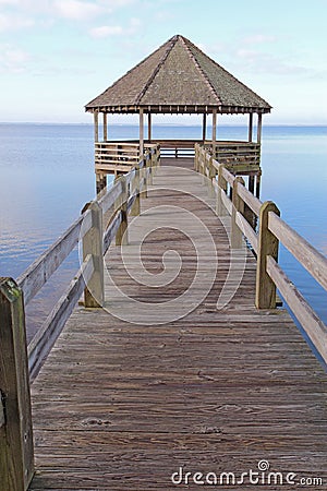 Gazebo and dock over calm sound waters vertical Stock Photo