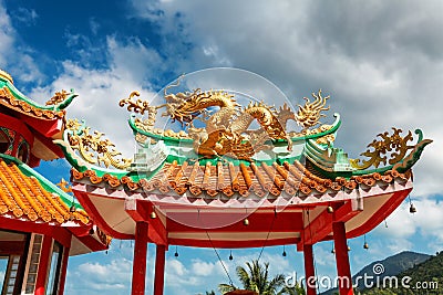 gazebo with a golden dragon on the roof of Chinese Sangthom Temple of the Goddess of Mercy Shrine in Chaloklum, Ko Pha Ngan, Thail Stock Photo