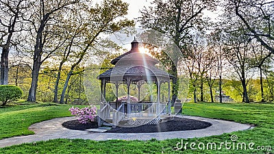 Gazebo in a park with trees around. Stock Photo