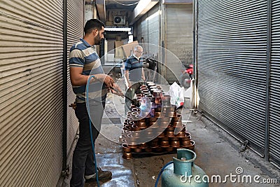 Gaziantep, Turkey-September 14 2020: Copper production and fire given to copper pots with oxygen tube Editorial Stock Photo