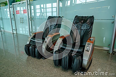 Gaziemir, Izmir, Turkey - 03.11.2021: two empty leather massage chairs in Aydin Menderes Airport for passengers Editorial Stock Photo