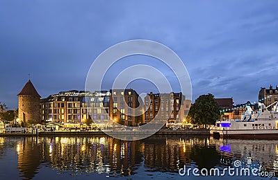 Gdansk Poland 2023 - bank of Motlawa river at night with Hilton hotel Editorial Stock Photo